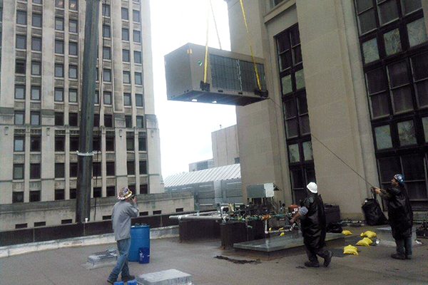 Crane lifting an HVAC system at the post office and courthouse in Pittsburgh, PA